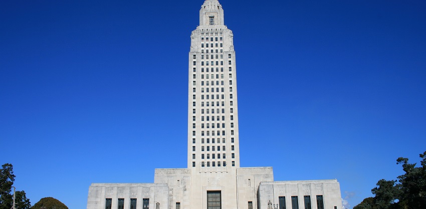 The Louisiana State Capitol building, a towering art deco structure near Datta Temple.