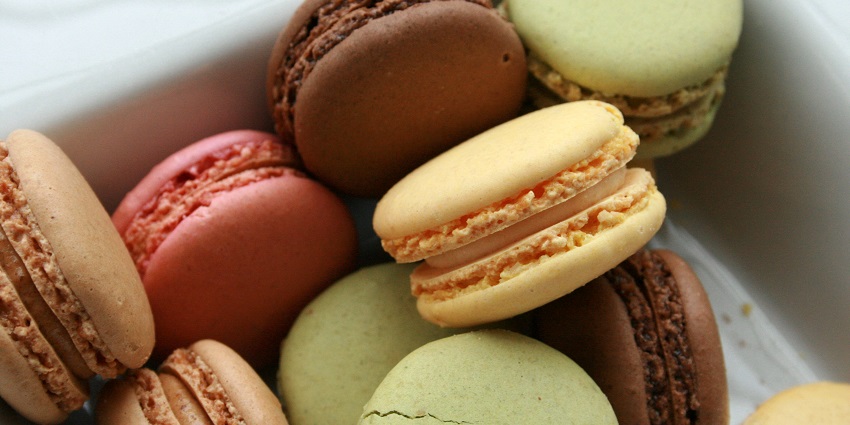 Luxurious, colorful macarons filled with delicate flavors at an iconic patisserie.
