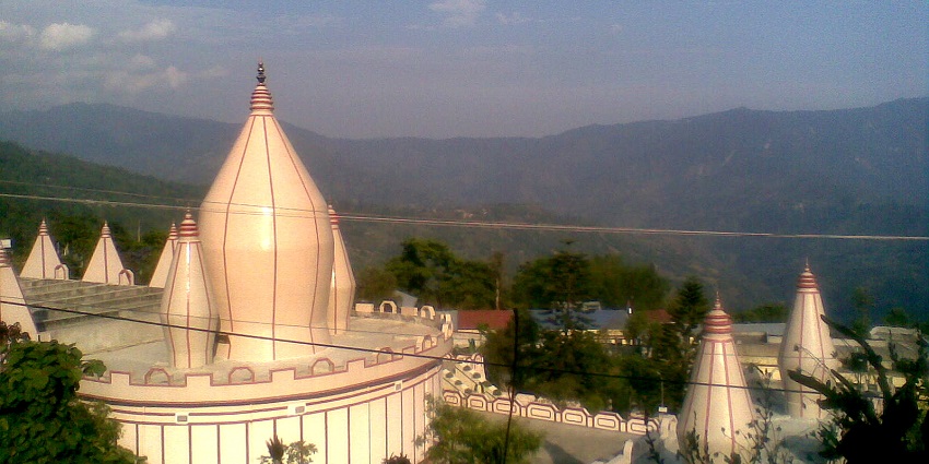 An image of the serene Mangal Dham Temple with beautiful architecture, hides a dark reputation.