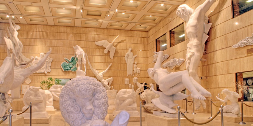 A picture of the spacious Marshall M. Fredericks Sculpture Museum interior in Michigan.