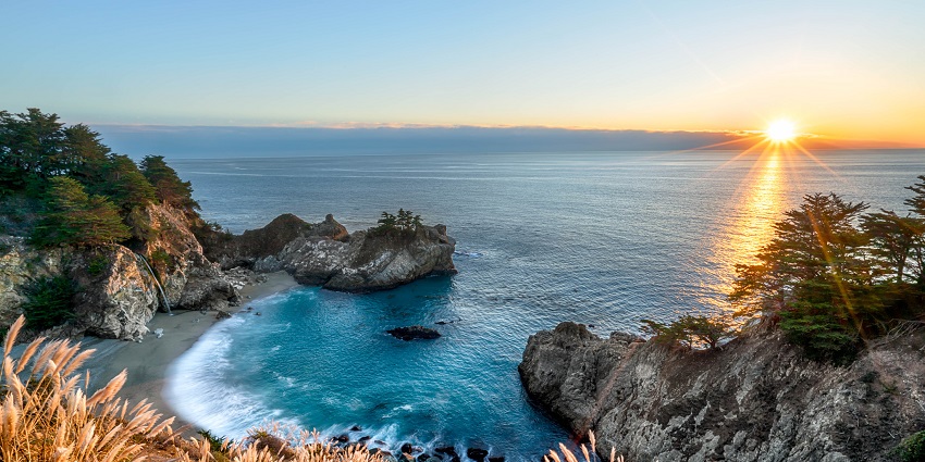 A view of McWay Falls, one of the waterfalls in California, cascades into the Pacific Ocean.