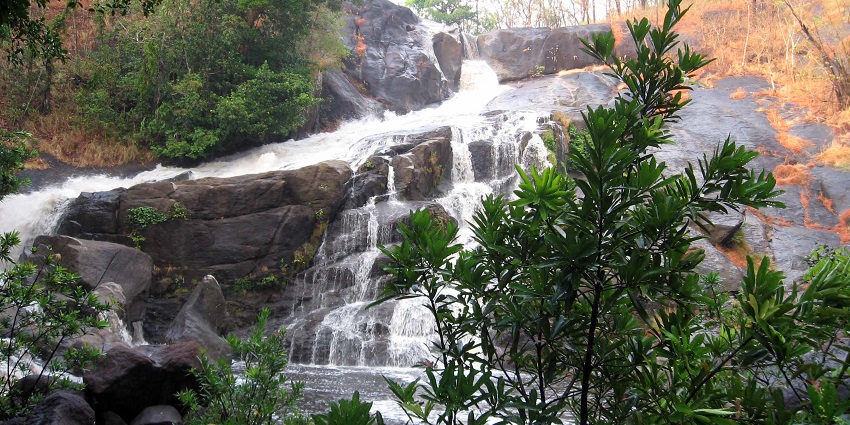 A picture of Meenmutty Falls, one of the best places for trekking places in Tamil Nadu.