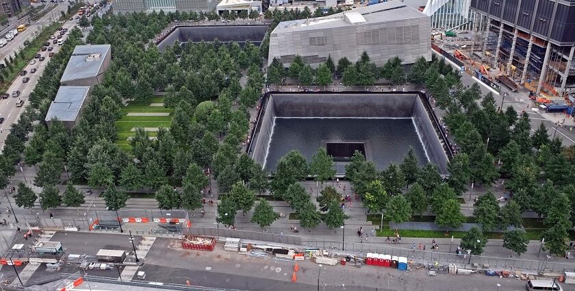 An aerial view of the 9/11 Memorial and Museum, showcasing the Twin Towers' footprints.