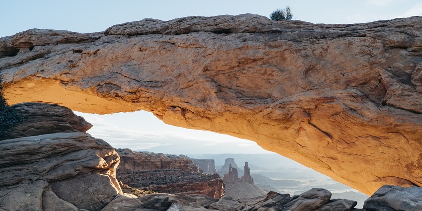 Mesa Arch, a popular destination near Arches National Park, framing a stunning sunrise