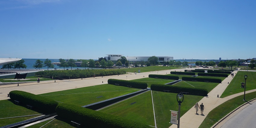 Grounds of the Milwaukee Art Museum with a large white sculpture and lake view.