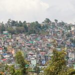 Kalimpong's monasteries with the lush green hills and mountains in the background.