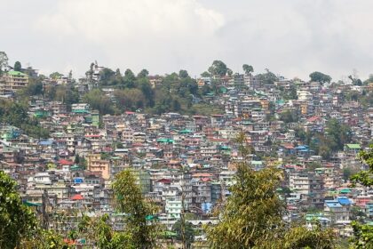 Kalimpong's monasteries with the lush green hills and mountains in the background.