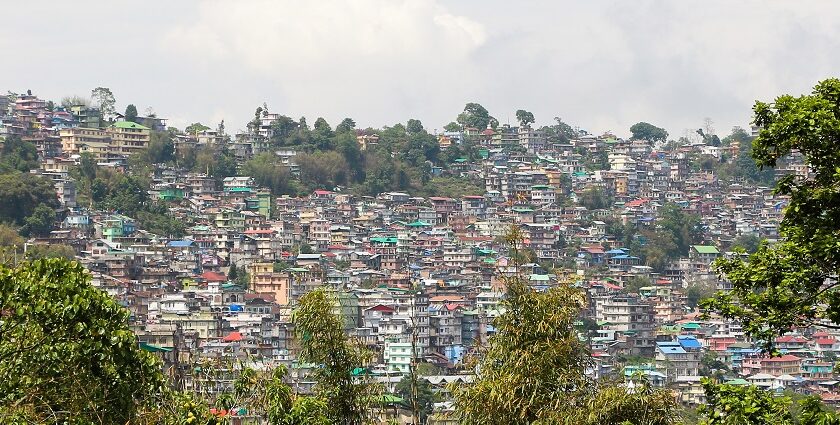 Kalimpong's monasteries with the lush green hills and mountains in the background.