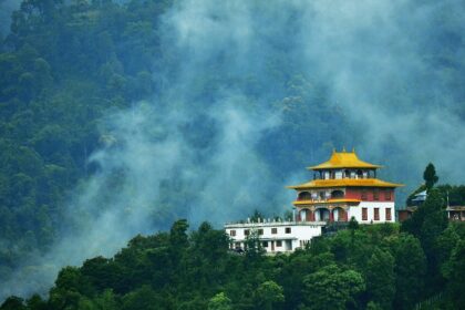 A scenic view of one of the best monasteries in Siliguri with lush greenery and landscapes.