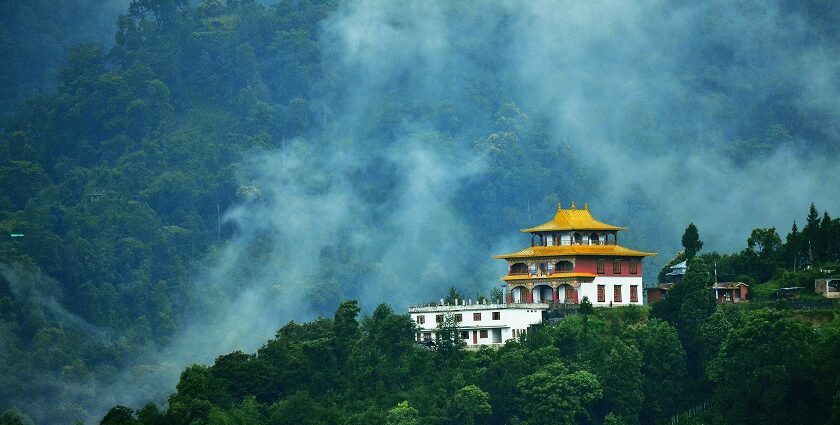 A scenic view of one of the best monasteries in Siliguri with lush greenery and landscapes.