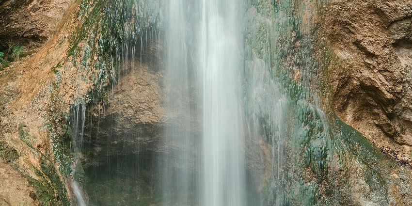 A picture of the refreshing Monkey Falls, one of the best places to visit in Valparai.