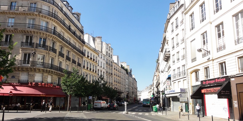 Historic Parisian district with artisanal shops, street artists, and cafes