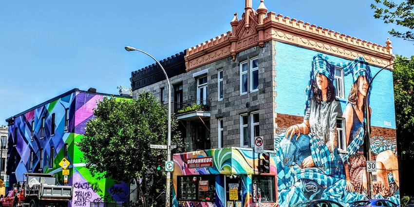 Image of Montreal city corner with graphic arts on the wall - places to visit in canada in june
