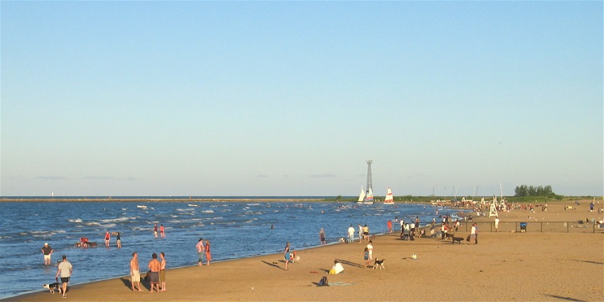 An image of the huge sandy Montrose Beach with its visitors, located in Chicago.
