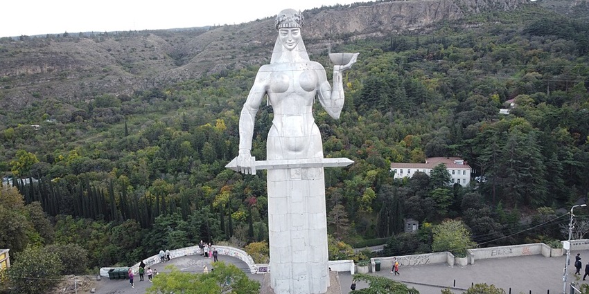 An iconic statue representing Georgia’s strength, overlooking Tbilisi cityscape.