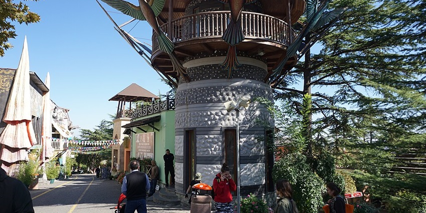 Amusement park on a hilltop offering views and entertainment.