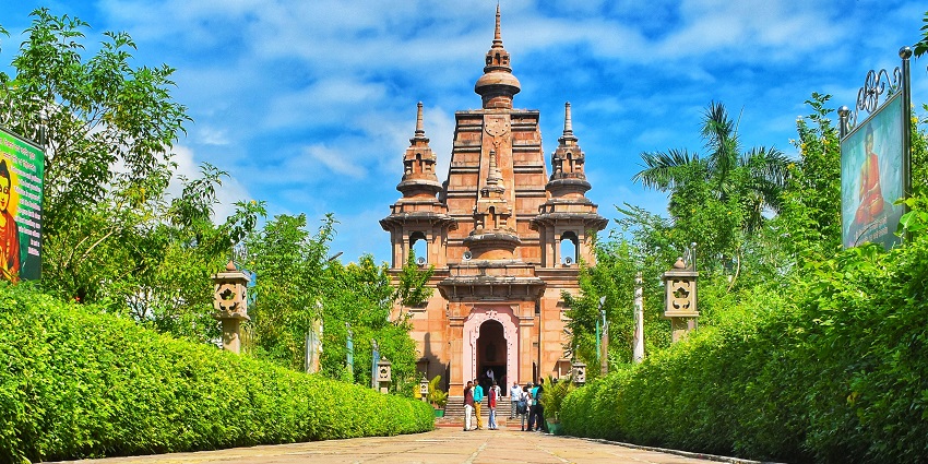 View of Mulagandha Kuti Vihar, a modern Buddhist temple adorned with beautiful frescoes.