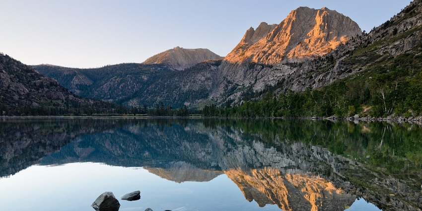 Serene view of Nachiketa Tal lake located in the foothills of the Himalayan ranges.