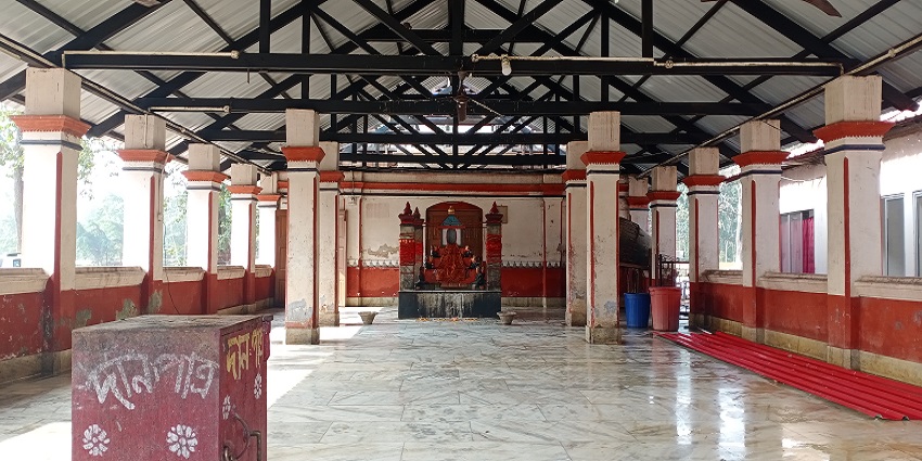 Serene temple honoring Nag Devta amidst mountain scenery