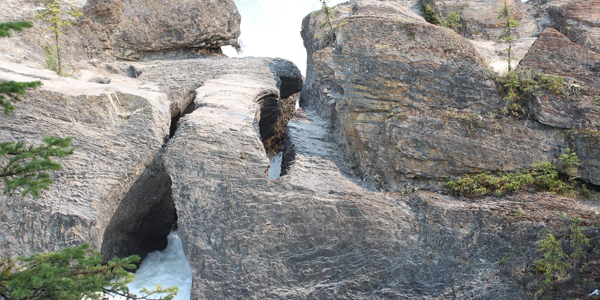 An image of Natural Bridge, a famous destination near Yoho National Park.