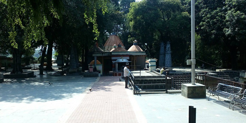Sacred temple dedicated to Lord Shiva, surrounded by nature.
