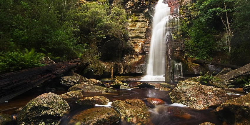 A huge Waterfall near Kunjapuri Temple in India with beautiful surroundings and scenery.