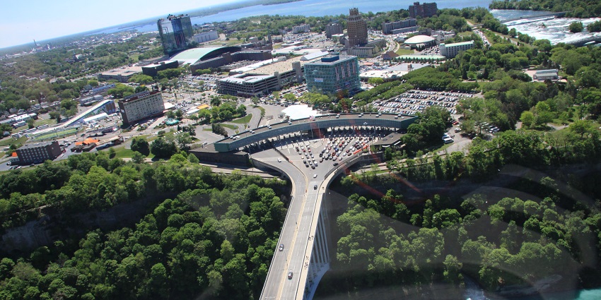 Scenic view of Niagara Falls from a distance, showcasing the waterfall's grandeur.