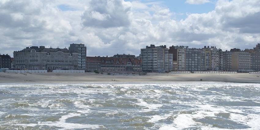 Belgium beaches featuring punding waves and historic sites.