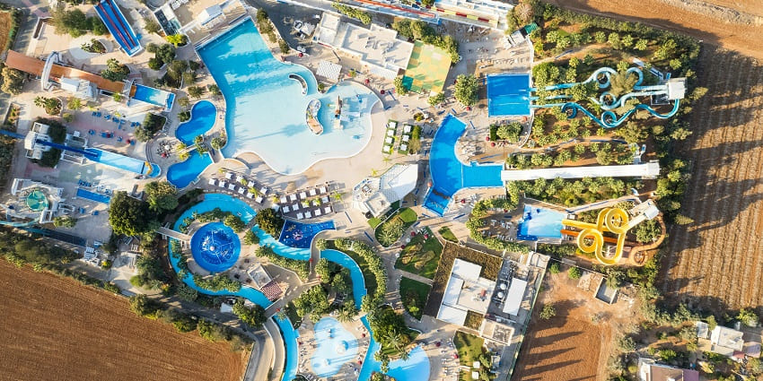 An image of Nilansh Water Park featuring its expansive landscape and large water pool.