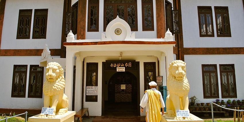 White-domed Nipponzan Myohoji Buddhist Temple in Darjeeling, serene hillside setting near aircraft museum kolkata