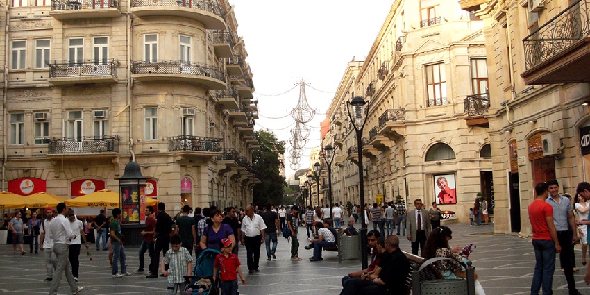 Famous pedestrian street with high-end shops, restaurants, and vibrant nightlife.