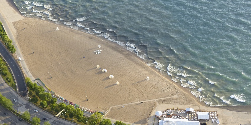 Aerial view of the famous Oak Street Beach in Chicago along with a huge Lake Michigan