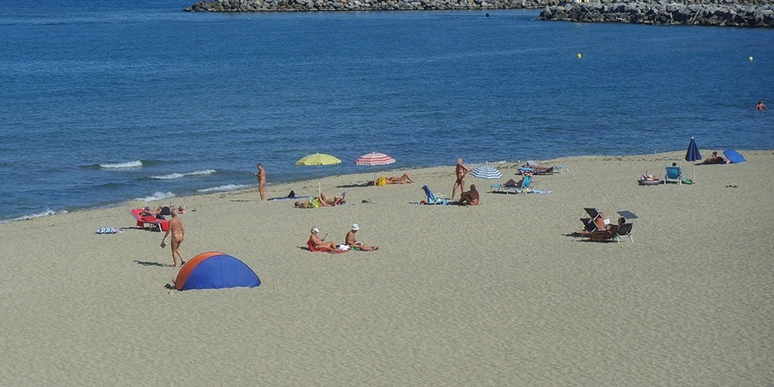 Tranquil Beach is surrounded by lush greenery and scenic views.