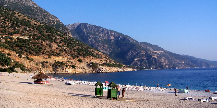 Famous beach destination with turquoise waters and paragliding opportunities.