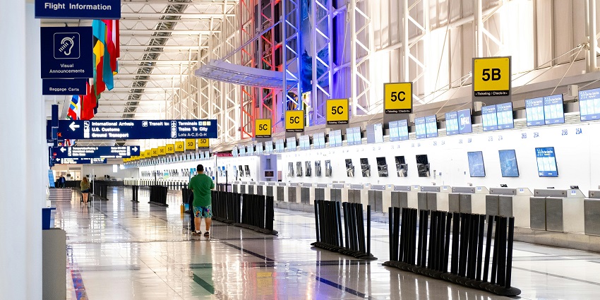 Interior of an airport with multiple sign boards, modern interior and people walking
Viewers of this file can see comments and suggestions