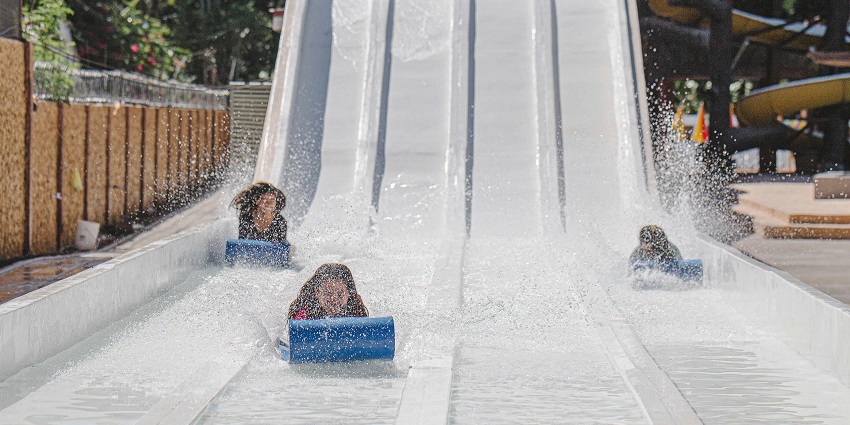 A picture of people enjoying a water slide at a water park in West Bengal