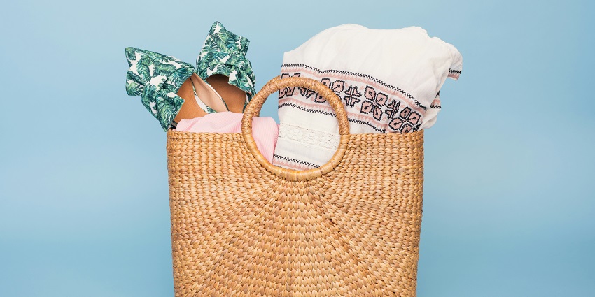 Image of a handcraft busket with beach essentials packed for Redi beach and sandals