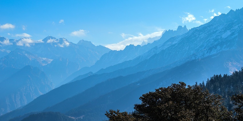 Snapshot of the beautiful mountain peaks covered by lush greenery and trees