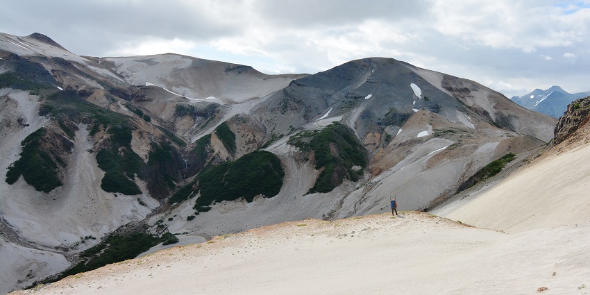 A beautiful view of ash-covered mountains in Katmai Park, Alaska, with rugged terrain