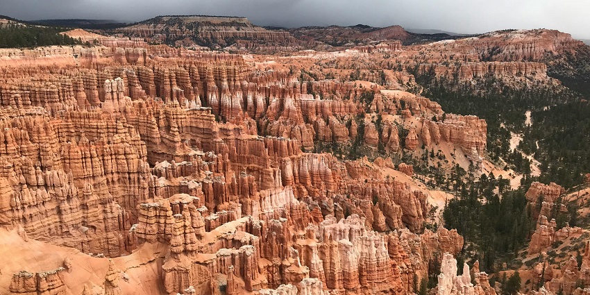 An image of a stunning view of unique rock formations and hoodoos.