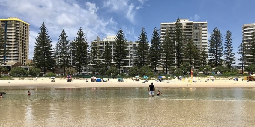 The famous Rainbow Bay looks ethereal with its beautiful sands and Pine trees.