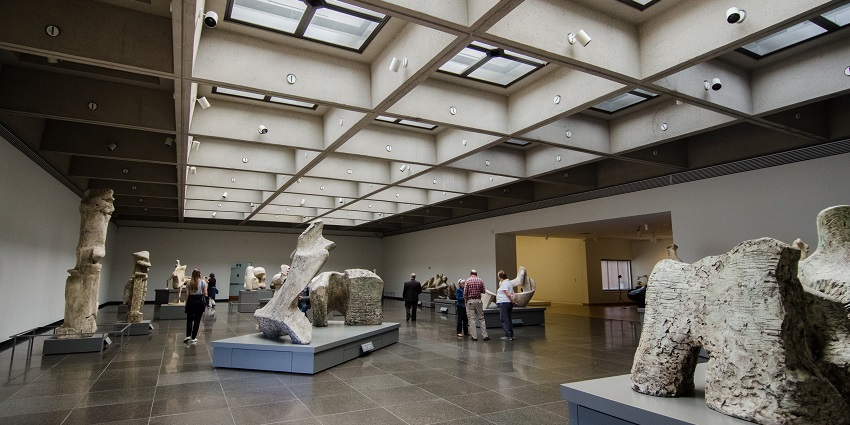 A picture of visitors enjoying their experience at the Art Gallery of Ontario, embracing art.