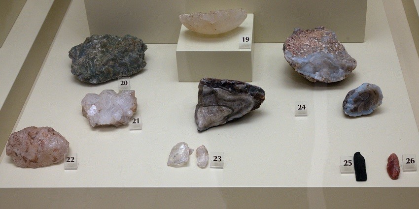 Minerals as materials in Mycenae and Fragment of a rock crystal vase. Unworked green steatite.