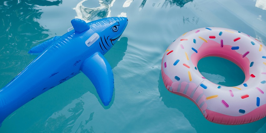 Image of a pool in water park and cute floaters floating on the pool
