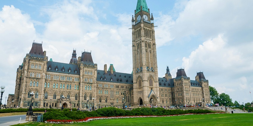 Mild sunrays are falling on Parliament Hill, one of the best places to visit in Ontario.