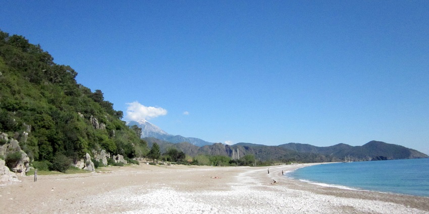 Quiet, picturesque beach with clear waters and serene ambience.