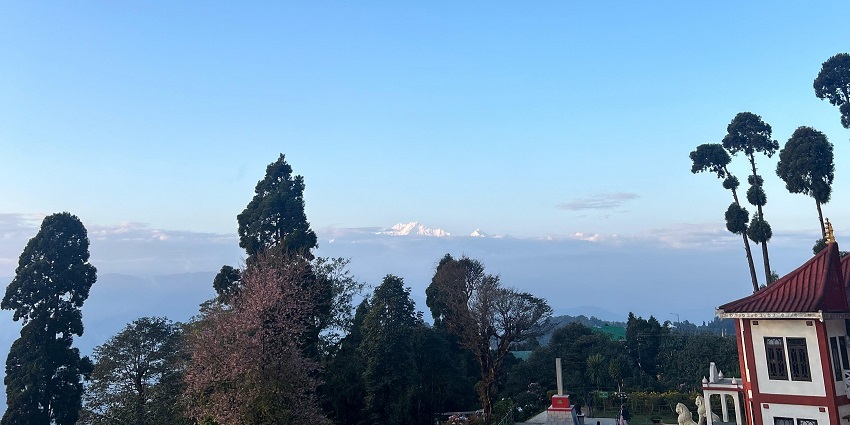 Kanchenjunga peaking through the clear sky as seen from a view point in Darjeeling.