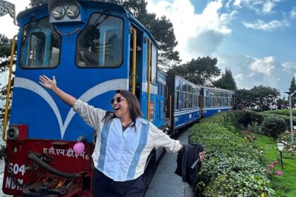 Preeti Singh of Taste of Siliguri posing in front of the iconic toy train or Joy Ride in Darjeeling.