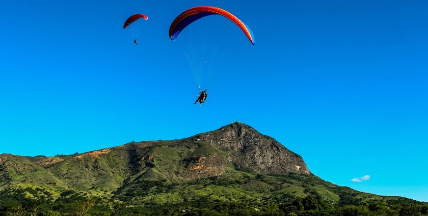 A picture of a paraglider enjoying the adventure during paragliding in Kalimpong