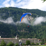 Paragliding in Interlaken offers breathtaking Swiss alpine views.